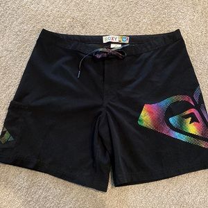 Black Roxy Board shorts with rainbow pattern.